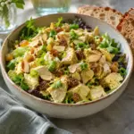 Coronation chicken salad with golden curry dressing, sultanas, green onion and sliced almonds